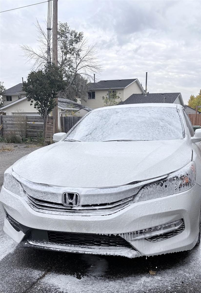 Exterior car detailing in Calgary — foam wash on a customer's vehicle