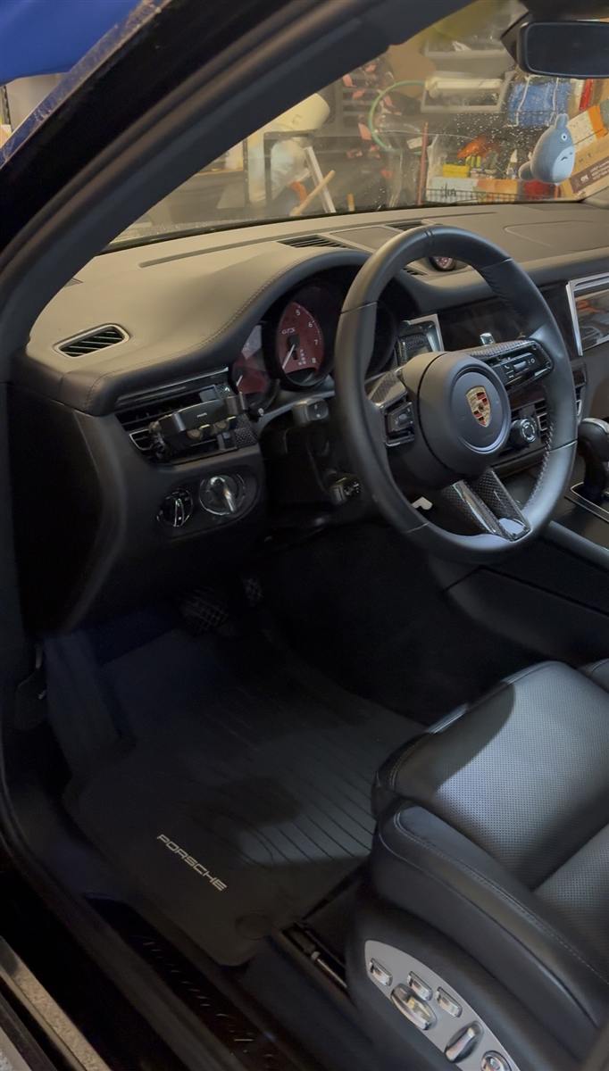 Freshly detailed Porsche interior — spotless dashboard and leather after an AE Detailing interior clean