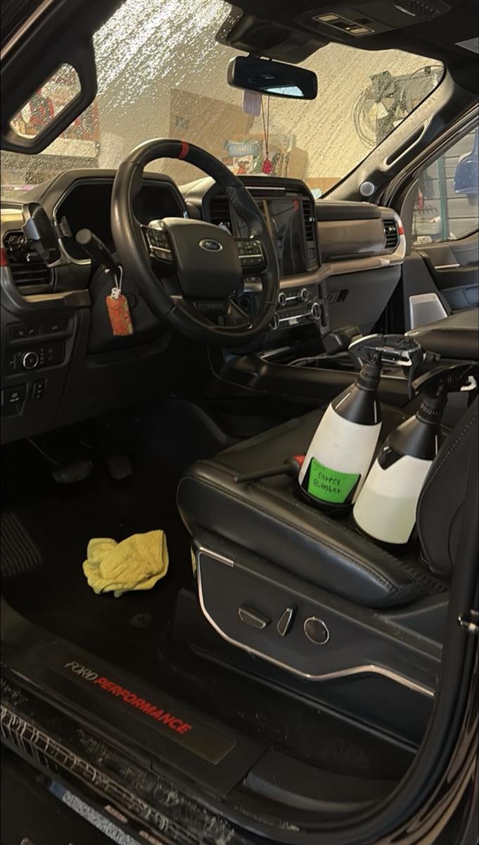Step 2: interior vacuum and wipe-down on a Ford truck's cabin